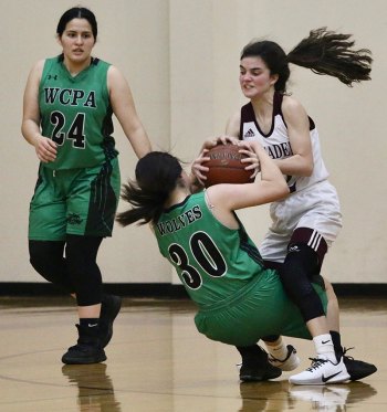 Kings Christian's Alexa Pierce battles for the ball against Wonderful College Prep Academy Friday night in Lemoore.